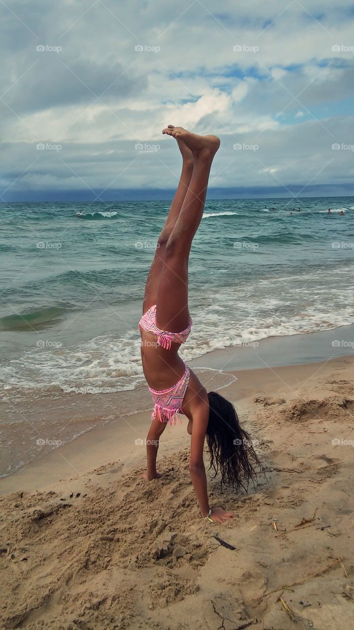 Handstand beauty on the beach