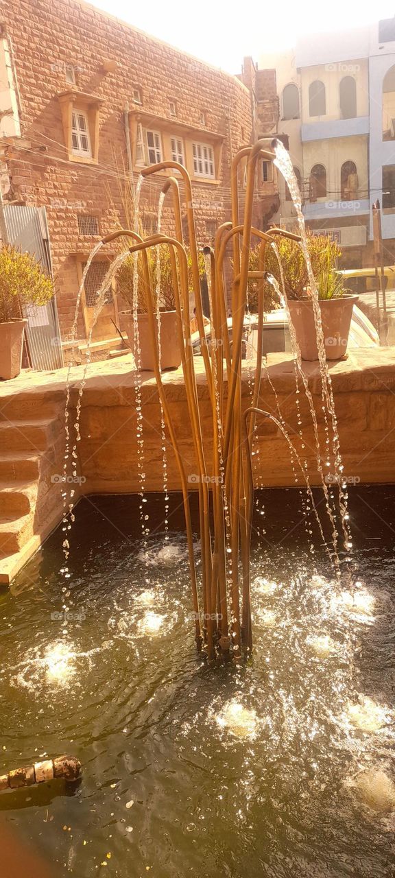 WATER FALLING FROM FOUNTAIN $$