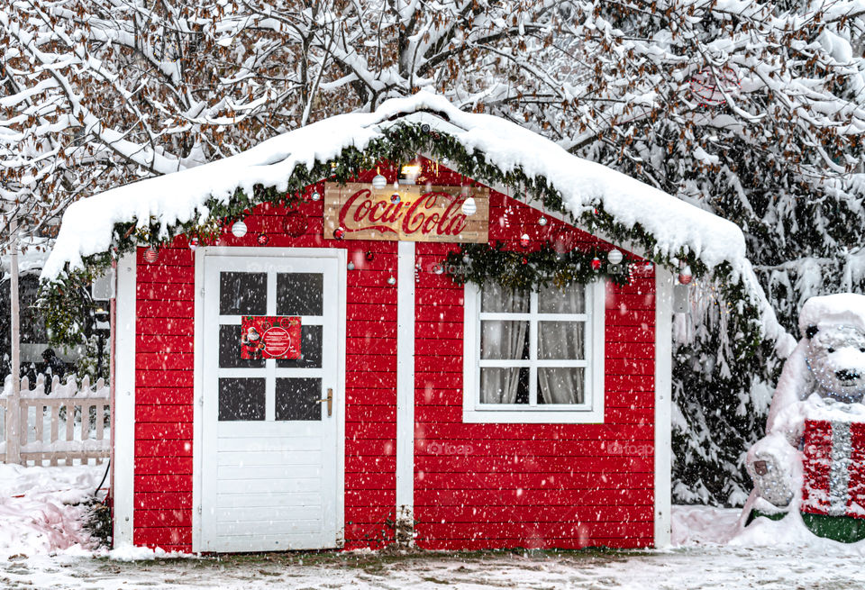 Wooden house under the snow