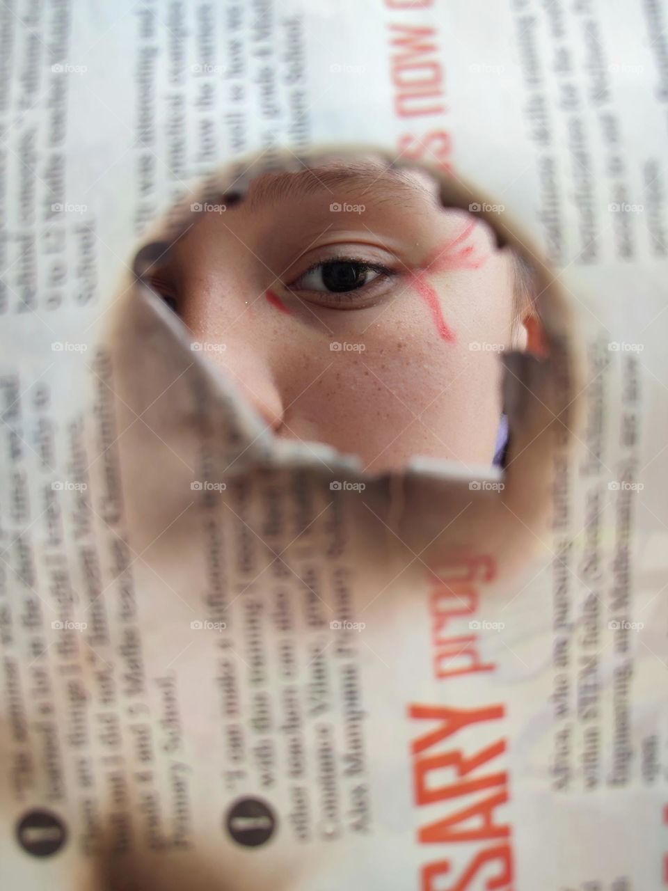 Looking through newspaper