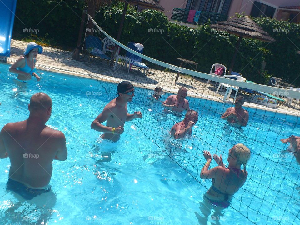 People playing pool volleyball