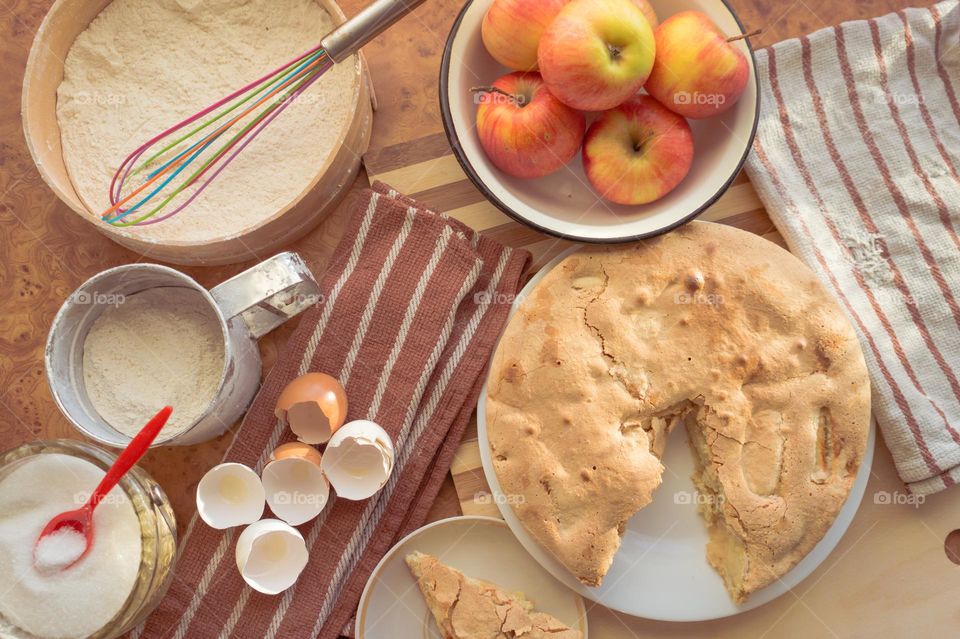 Making homemade puffed apple pie with eggs, sugar and flour.