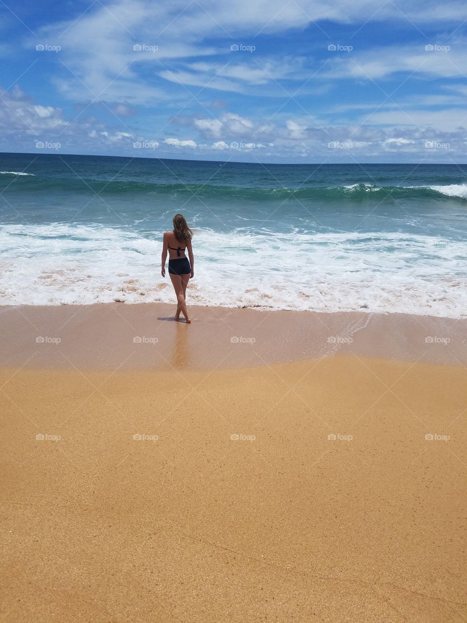 girl on beach shoreline