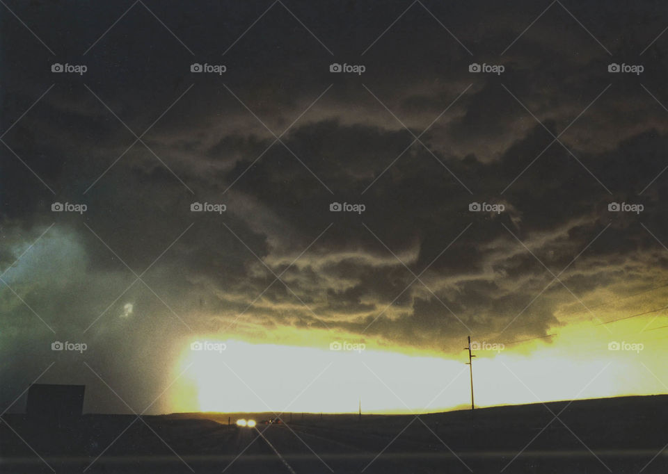 Underside of the wall cloud of a supercell thunderstorm in eastern Wyoming at sunset.