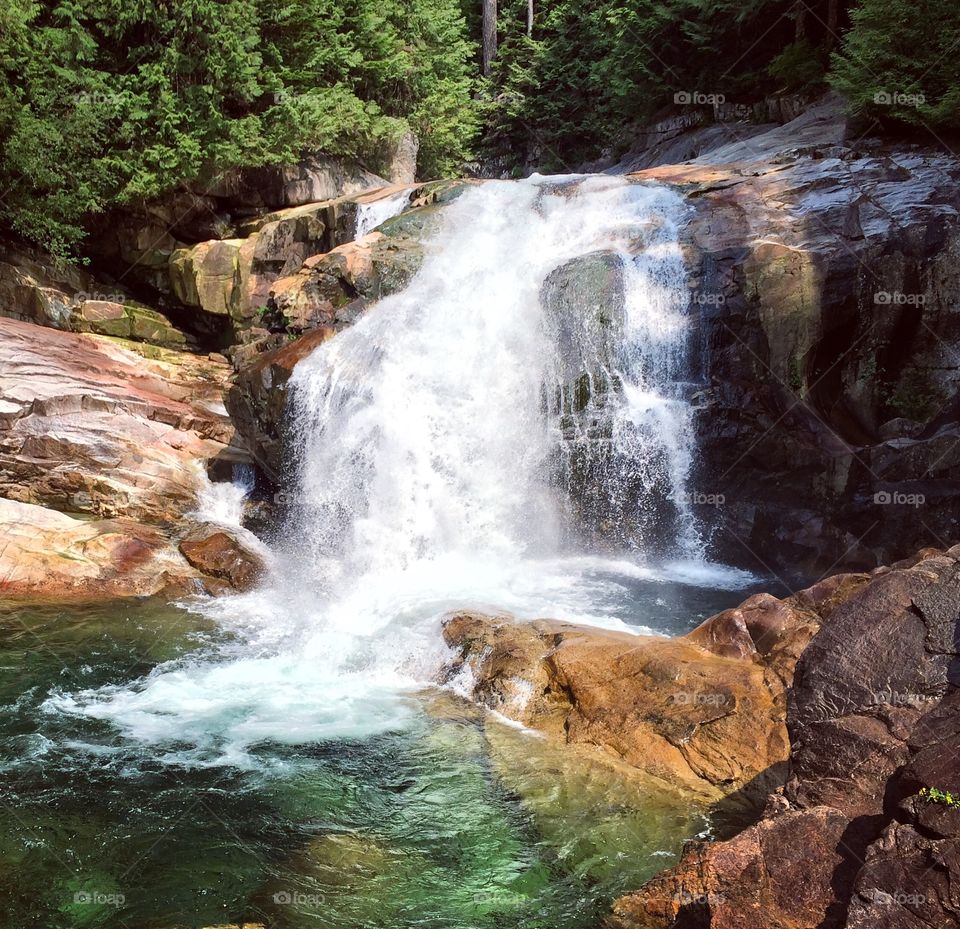 Lower Falls cascading at Gold Creek on a hot Summer day.