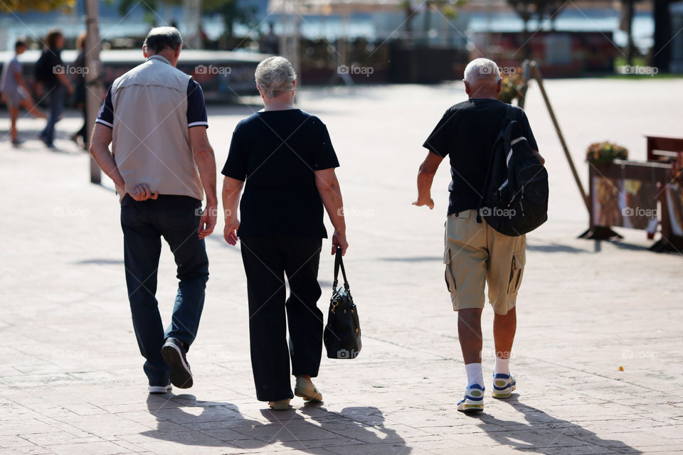 Three elder friends going for a walk