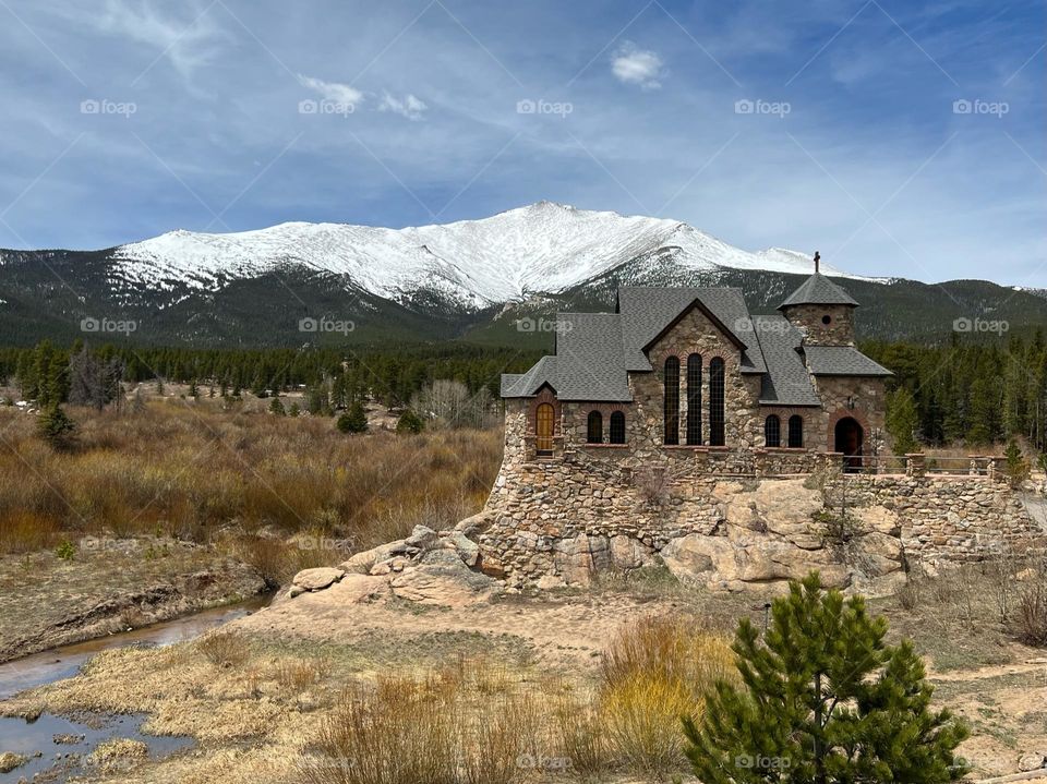 Pretty little church surrounded by the Rocky Mountains 