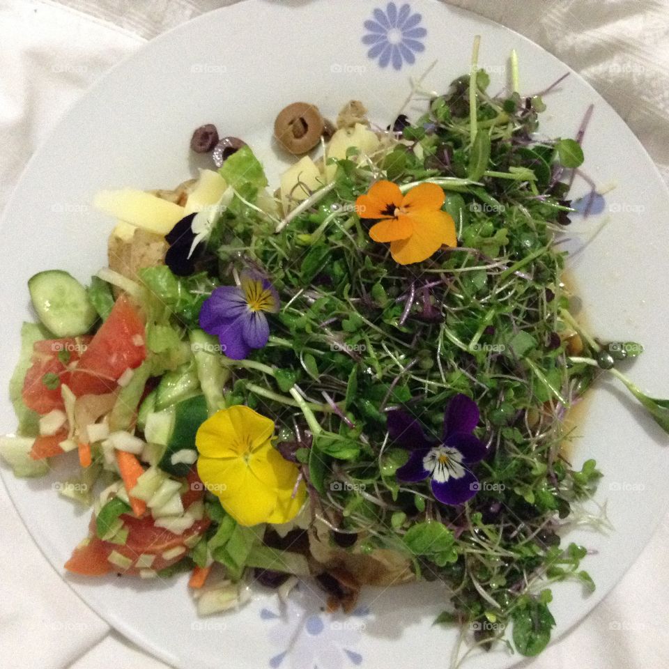Salad with edible flowers and microgreens.