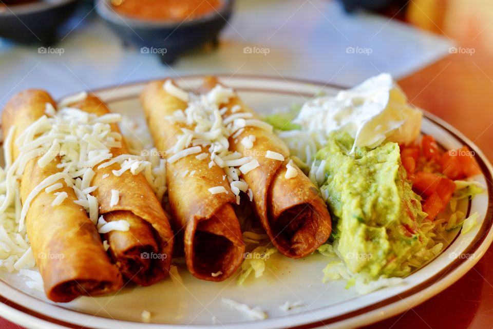 Fresh chicken Flautas with salsa and guacamole 