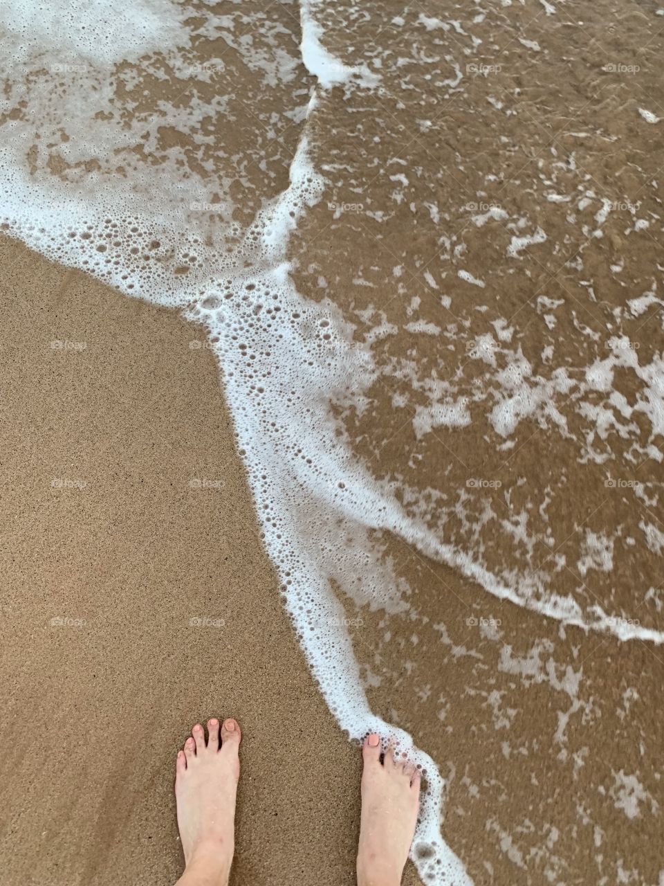 Toes in the water and toes on the sand (2). 