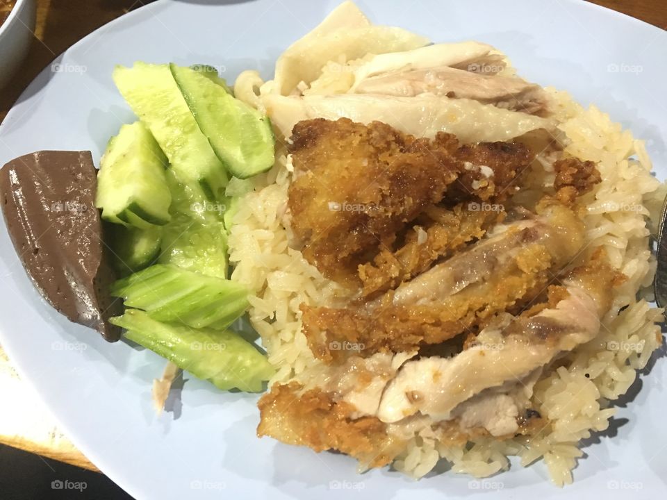 Boiled and fried chicken served with rice