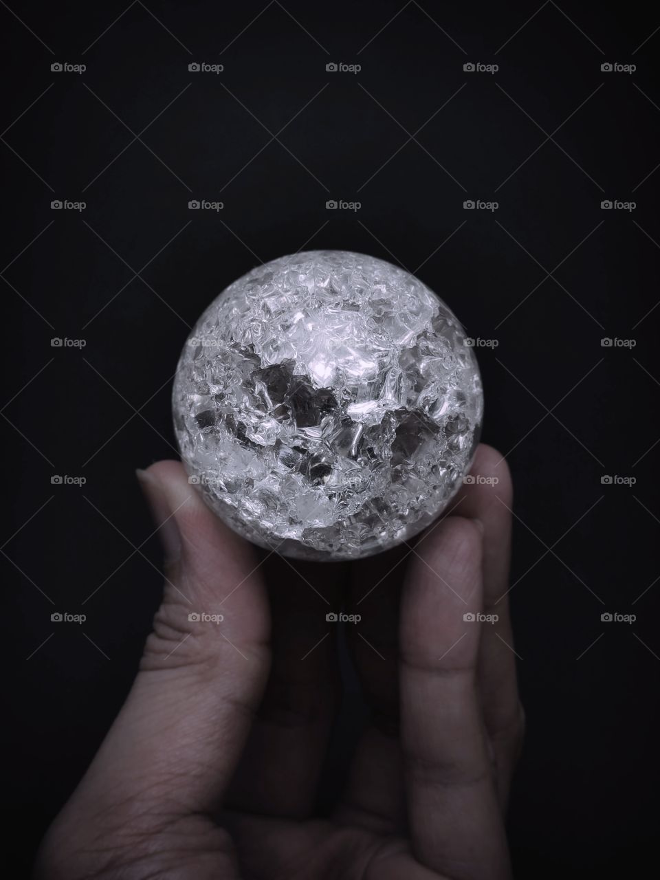 hand holding the crystal ball