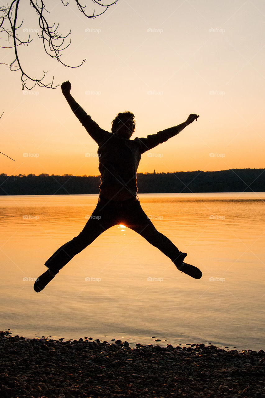 Man jumping at sunset