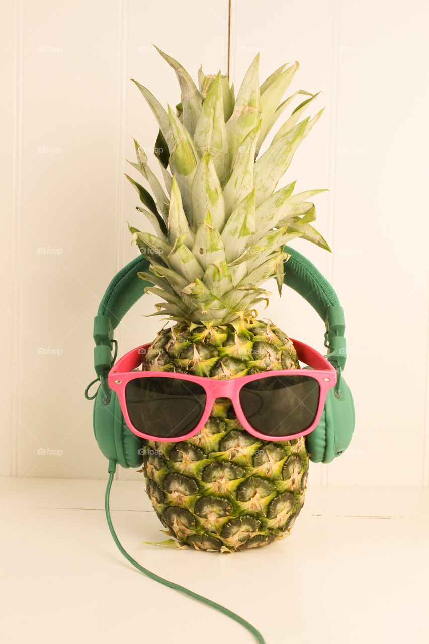 Pineapple wearing glasses and headphones