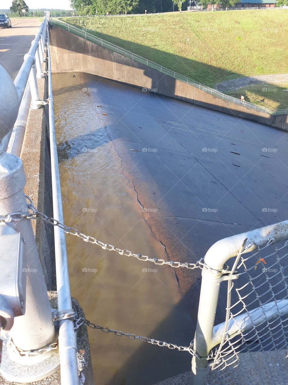 Water flowing over emergency spillway