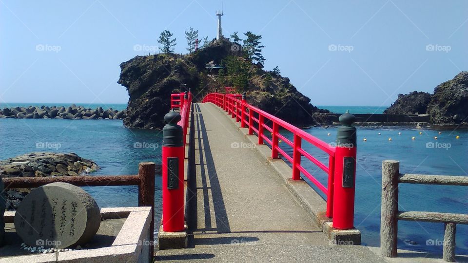 The elegant red railed bridge to the small island of Benten No Iwa, a famous landmark in Itoigawa.