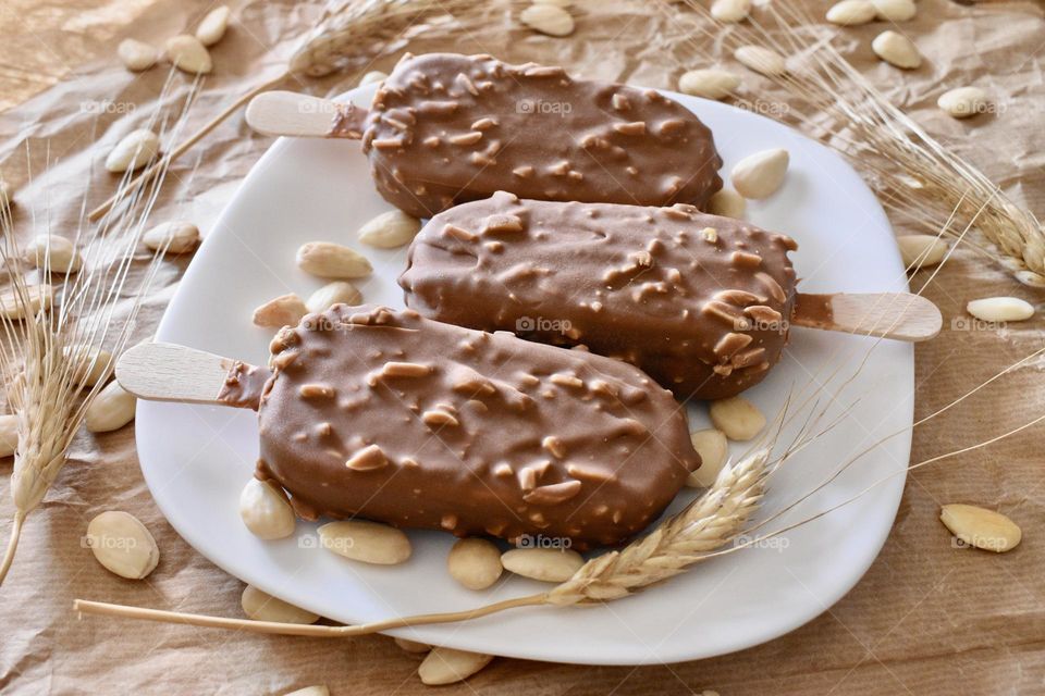 ice cream on a stick with almonds and cereals