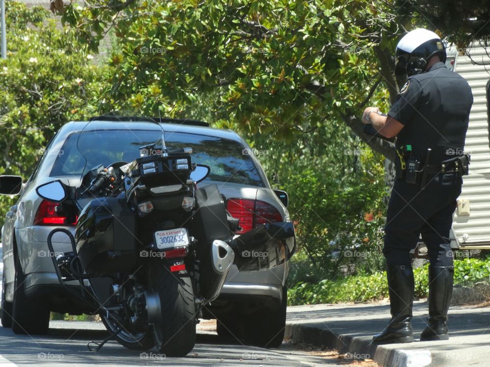 Police Officer Writing A Traffic Ticket