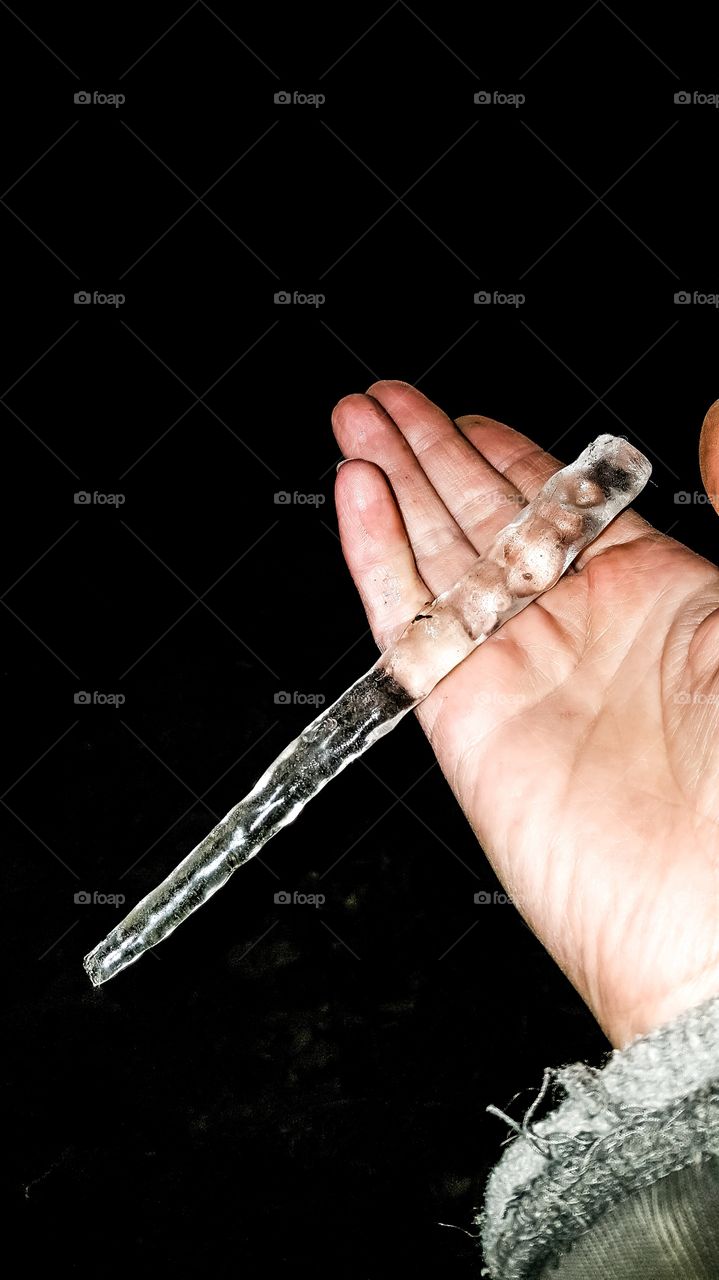 hand holding big ice cycle