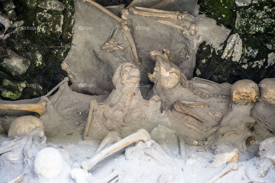 The eruption of Mt Vesuvius in 79 A.D. left many grasping for life. Total devastation. The archaeological site is very well preserved.