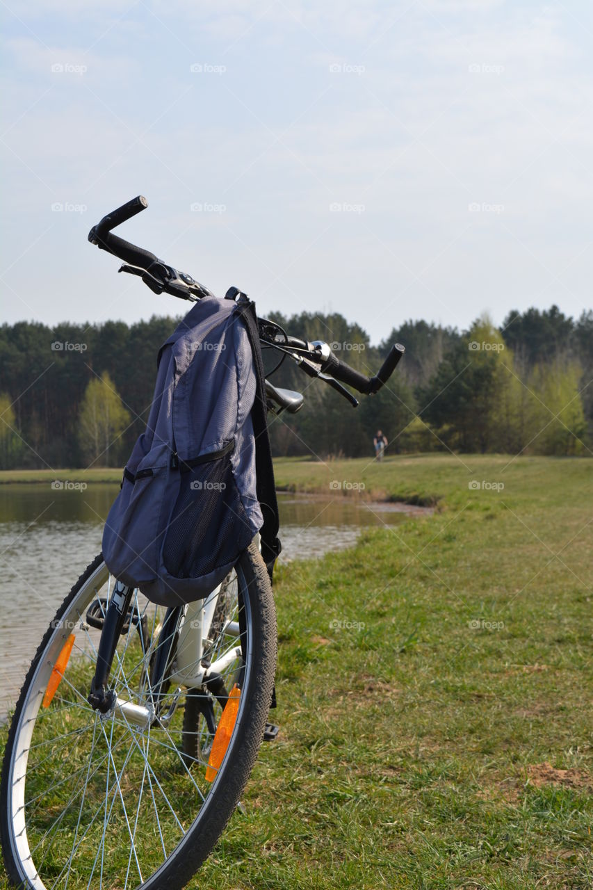 bike and backpack on nature landscape, social distance