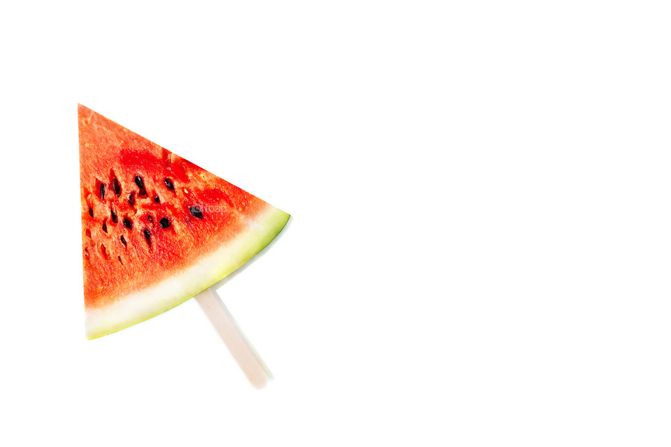 Water melon triangle piece with stick isolated on white, space for text