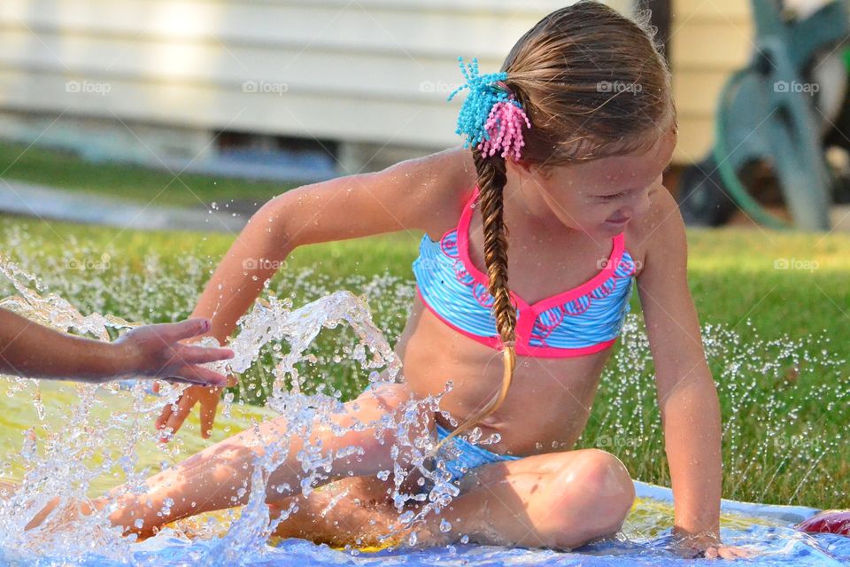Girl enjoying splashing water