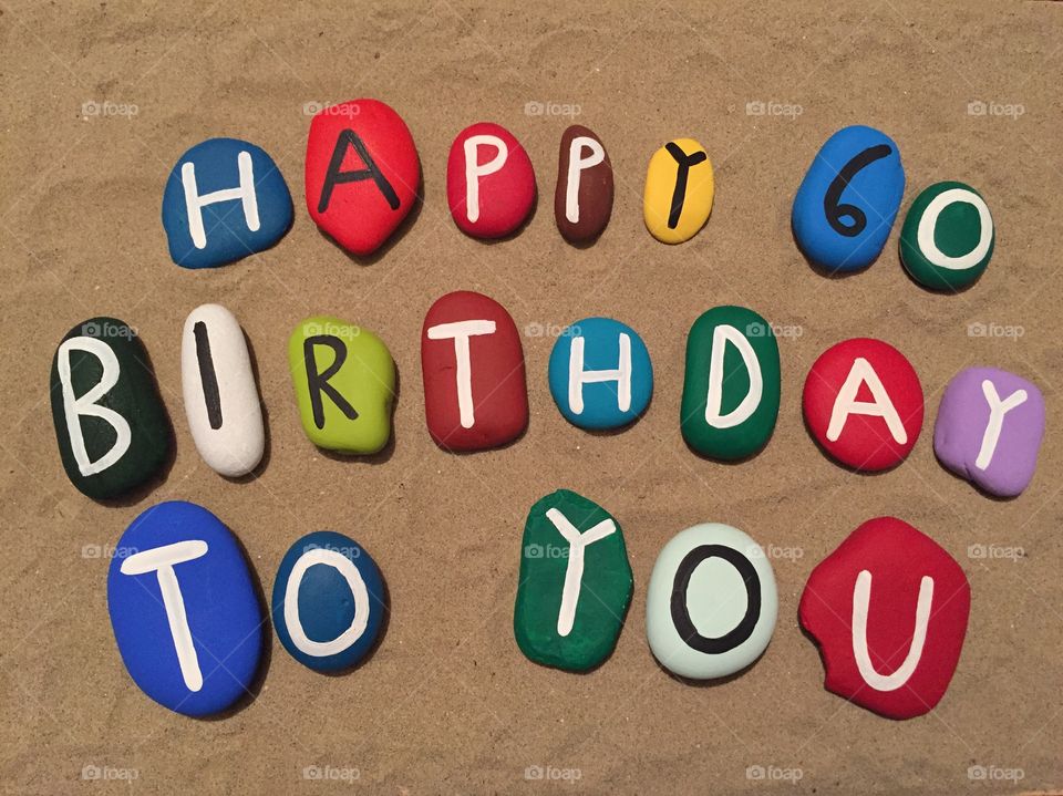 Happy Birthday to you, 60 years composition on colored stones