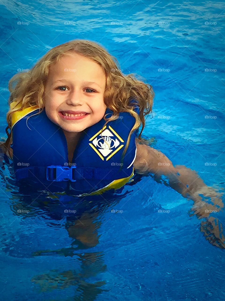 Portrait of a girl swimming in pool