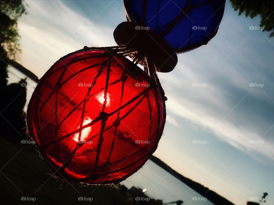 Sunset over Hamlin Lake through a glass ball decoration—taken in Ludington, Michigan 