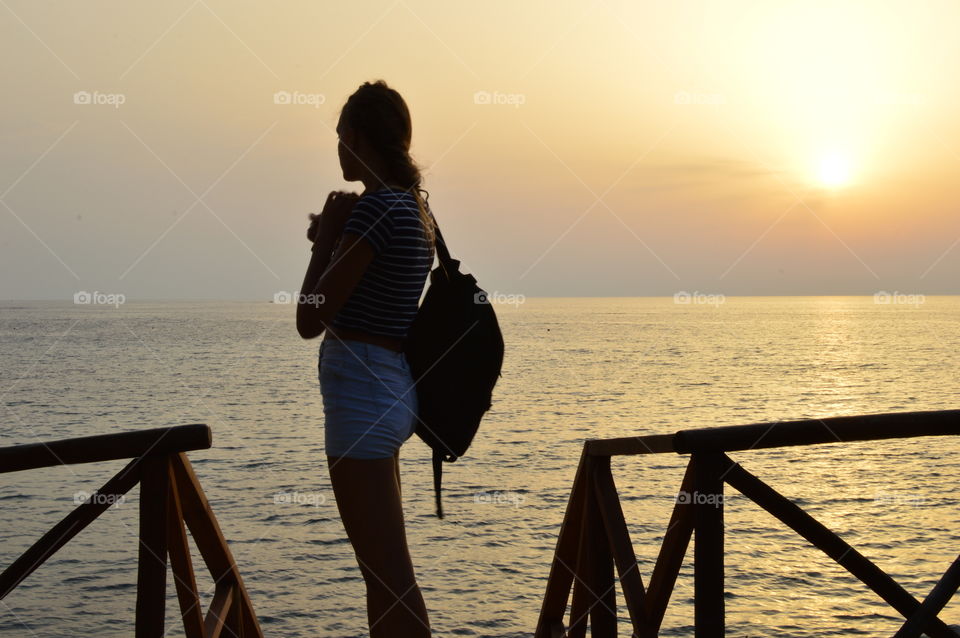 Girl at sunset on the beach