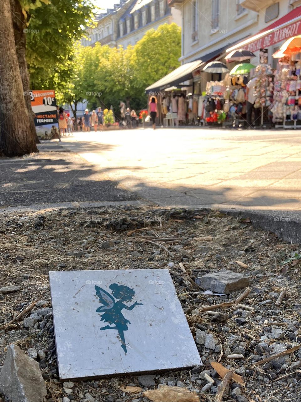 Tinker Bell symbol on a street pavement
