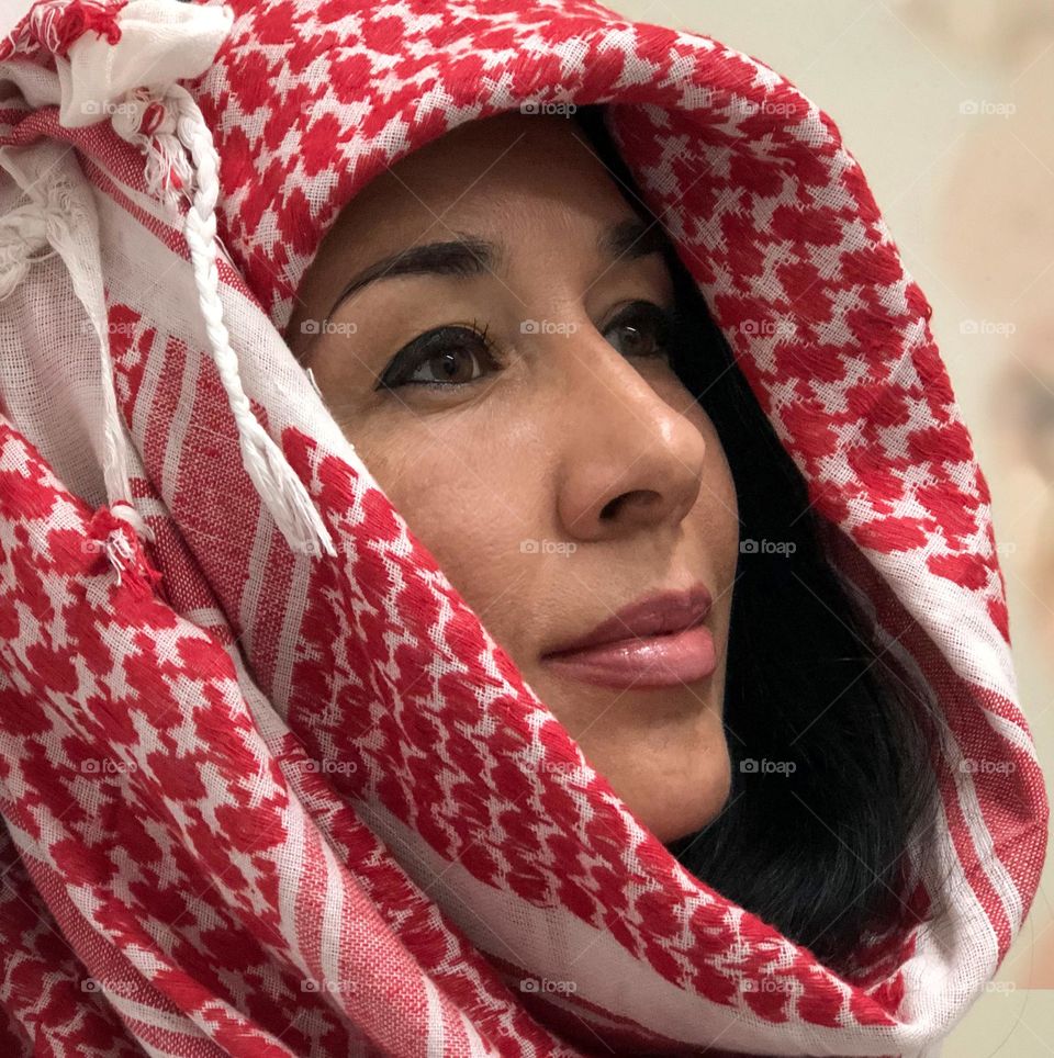 My name is Dina, nice to meet you 🙂 The photo was taken on a travel to Jordan. I'm with keffiyeh, traditional Arabian headdress