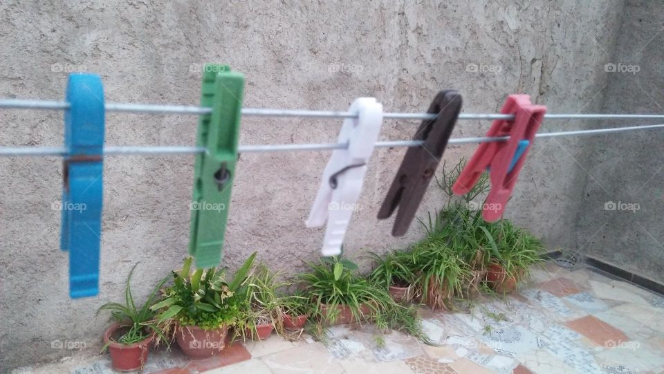 Colored handles hanging in wires.