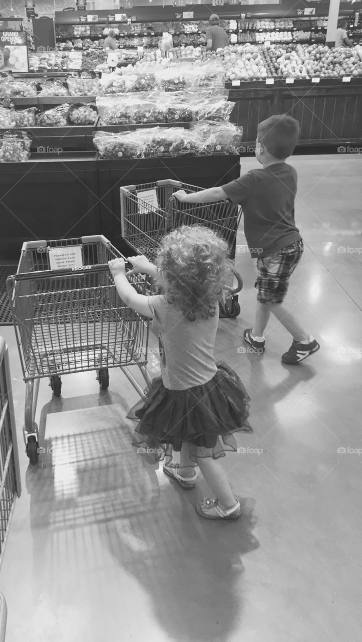 Kids shopping with carts