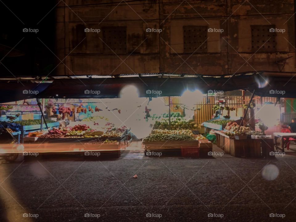 Night view of a traditional store by street. Long exposure, blured and defocused