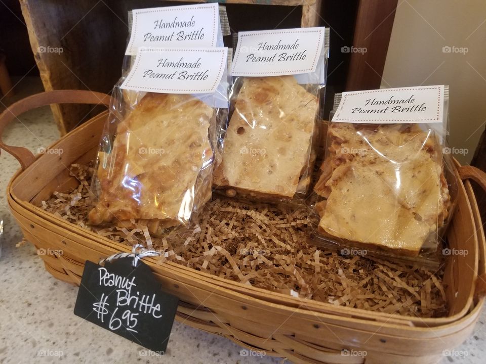 Handmade peanut brittle, packaged for sale.