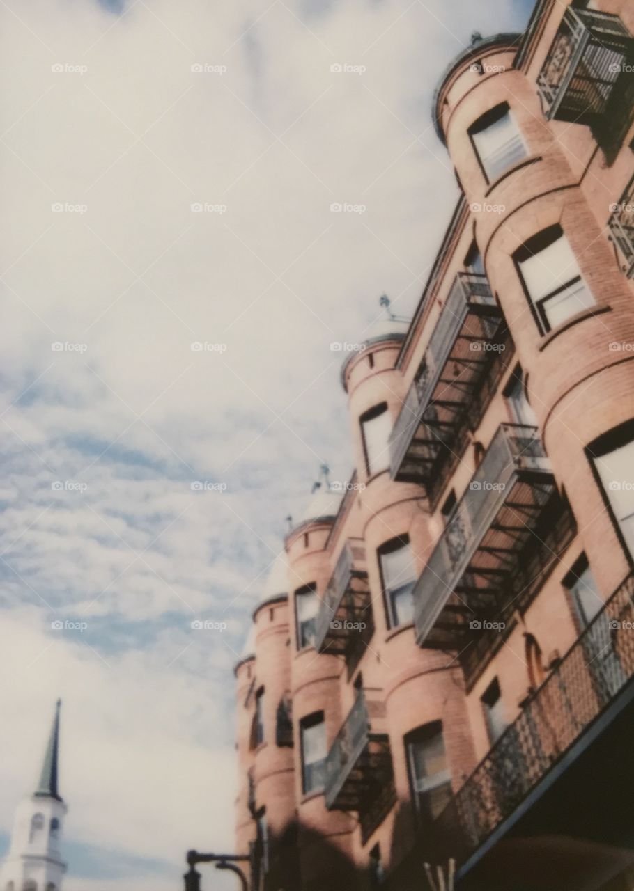 A scan of a FujiFilm Instax print I took of Victorian apartments on Church Street, Burlington, VT. 