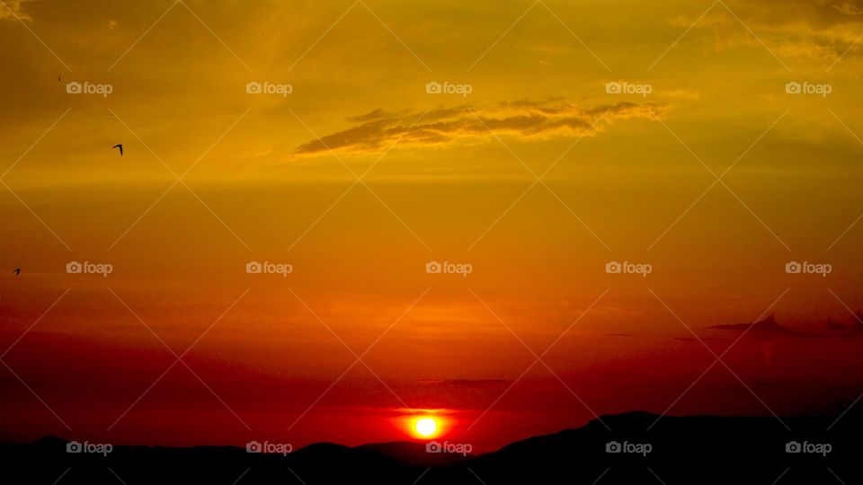 Deep sunset over Corfu Town Old Harbour, Greece