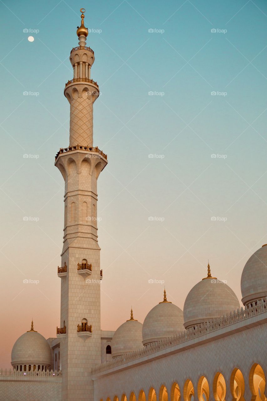 Mosque dome and moon at sunset sky 