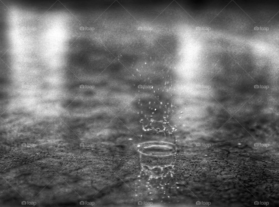Blurred motion of raindrop with reflection