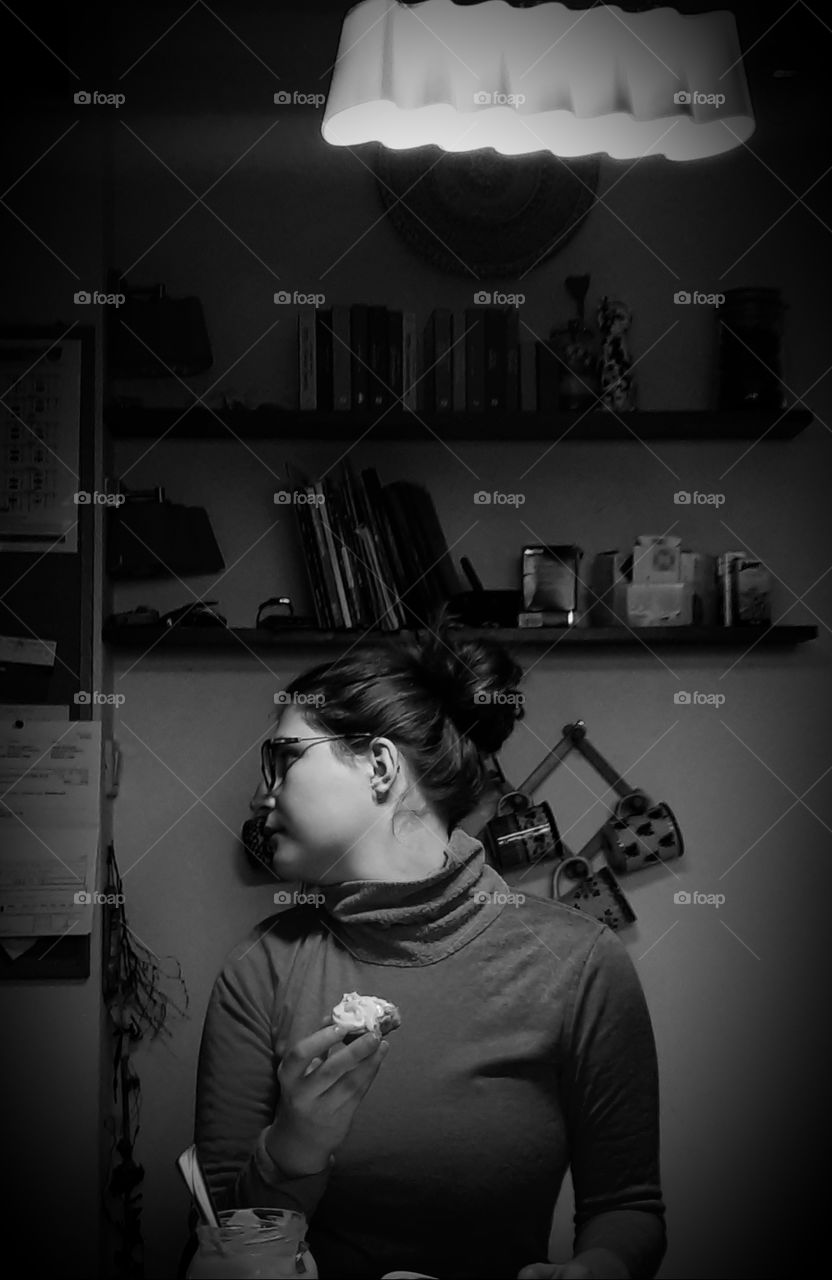 young girl having breakfast in the kitchen