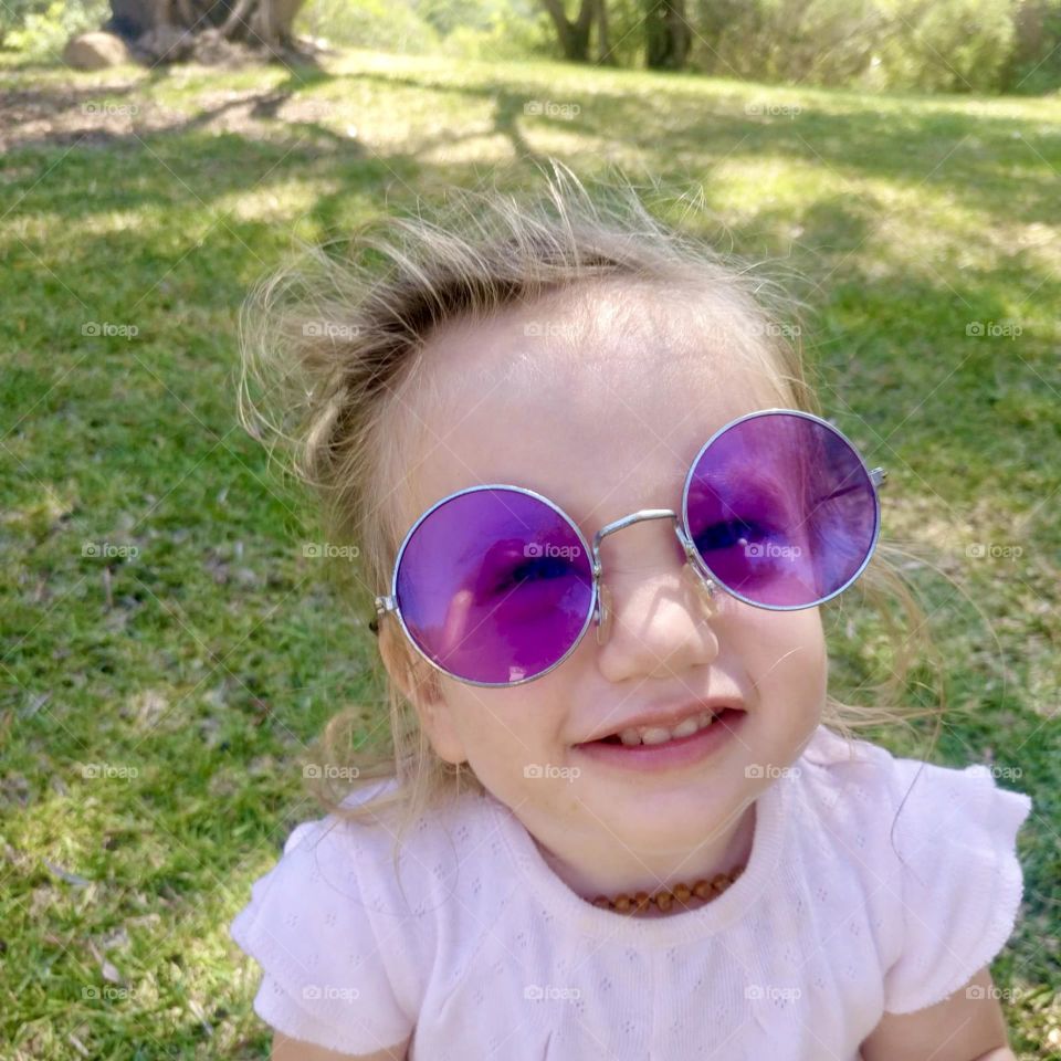 Girl with round purple sunglasses 