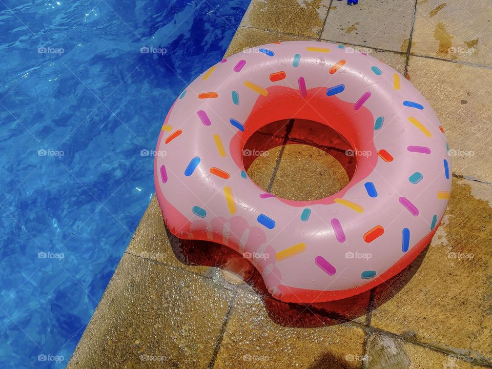 Donut float next to the pool 