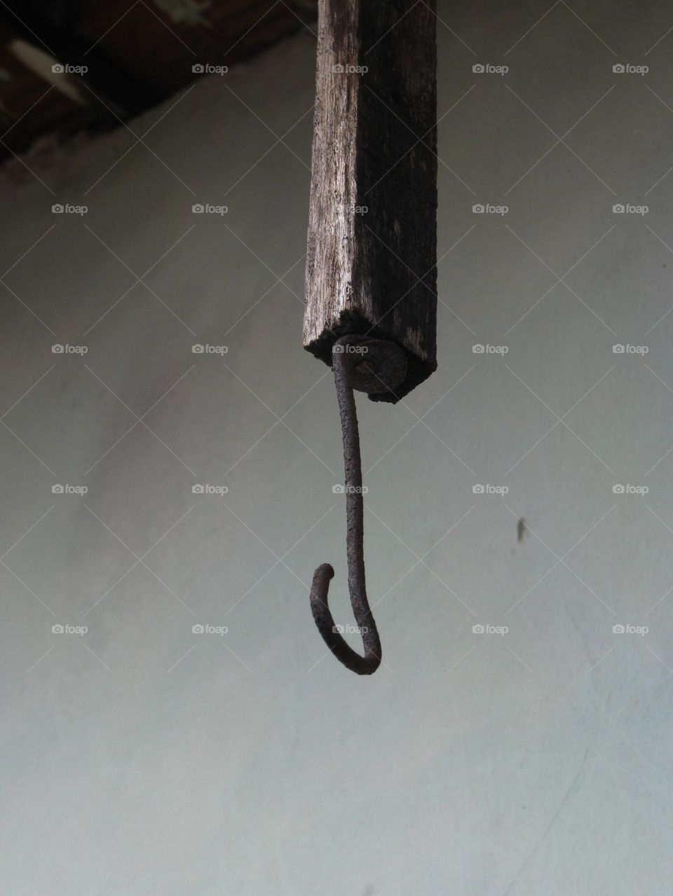 Old metal handle hanging on the rope in low angle view