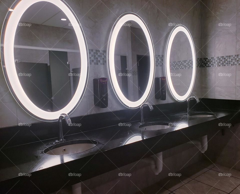 three mirror in the gym wall