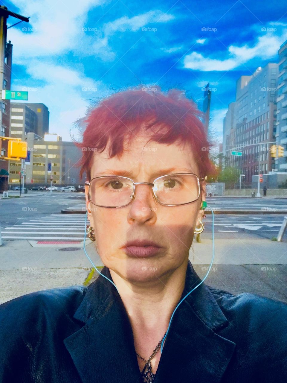 This photograph reminds a bit of the surrealistic style of late 1970s bands like „Pink Floyd“. I, „Petra Schiller“ a.k.a. „Maxine Firefox“ am standing on „Borden Ave“ in LIC, Queens contemplating a thing or two. 2020. Hypnotic Productions