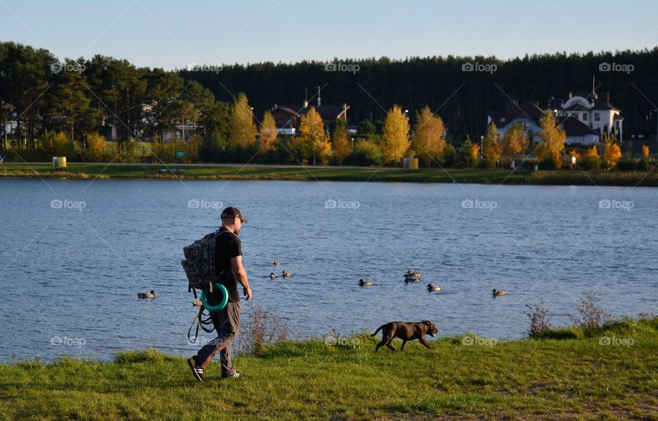 morning walking person with dog autumn time