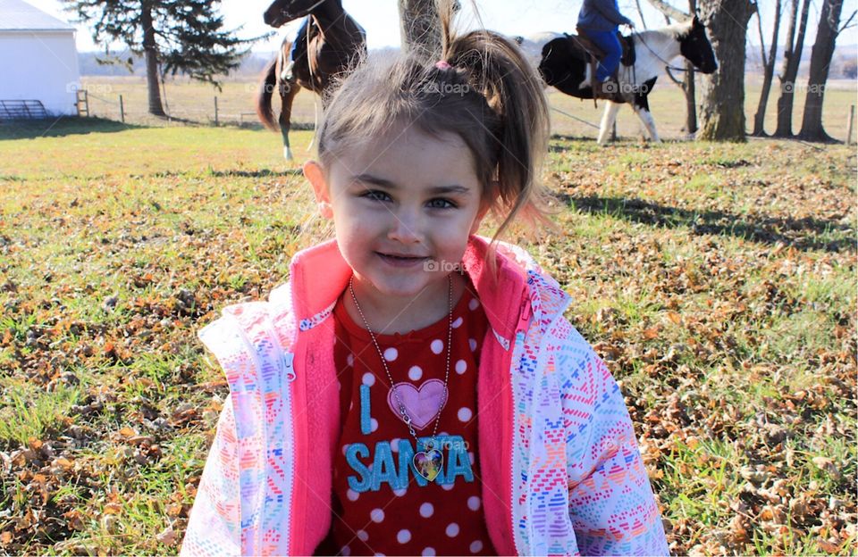 Little Girl On Horse Farm With Santa Shirt 