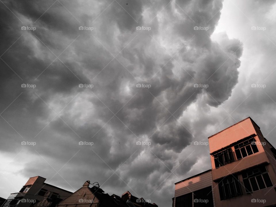 Stormy tropical clouds above building in Teluk Intan Malaysia